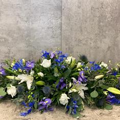 Blue and white casket spray 